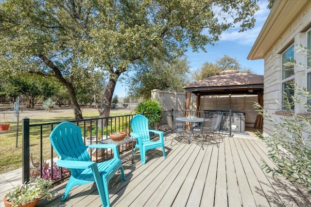 wooden terrace featuring outdoor dining space and a lawn