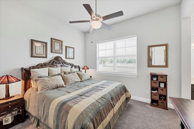 carpeted bedroom featuring ceiling fan and baseboards