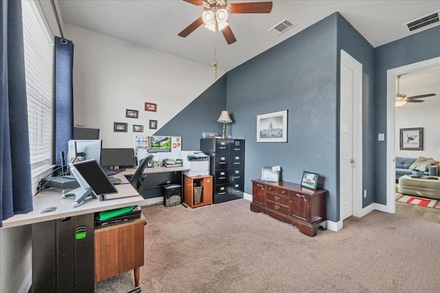 carpeted home office featuring baseboards, visible vents, and a ceiling fan