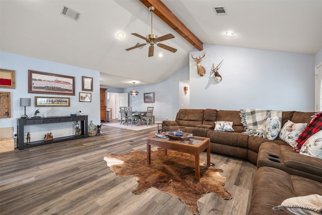 living area with lofted ceiling with beams, ceiling fan, visible vents, and wood finished floors