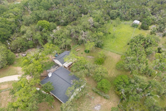 aerial view featuring a wooded view