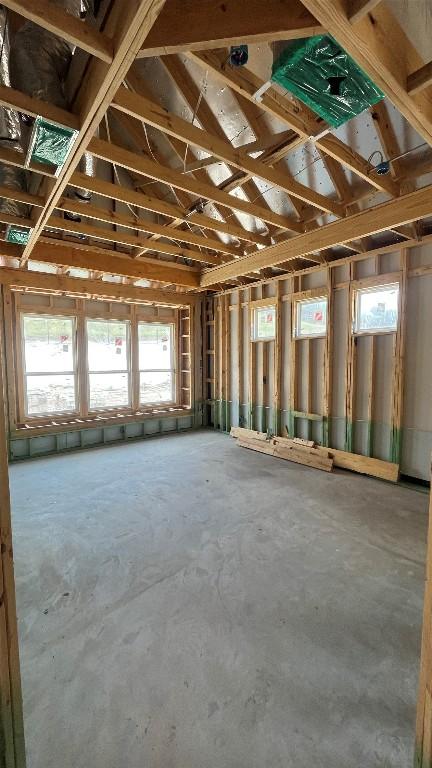 1408 Jolie Rose Bnd, Leander, TX 78641 - miscellaneous room featuring healthy amount of natural light and concrete flooring