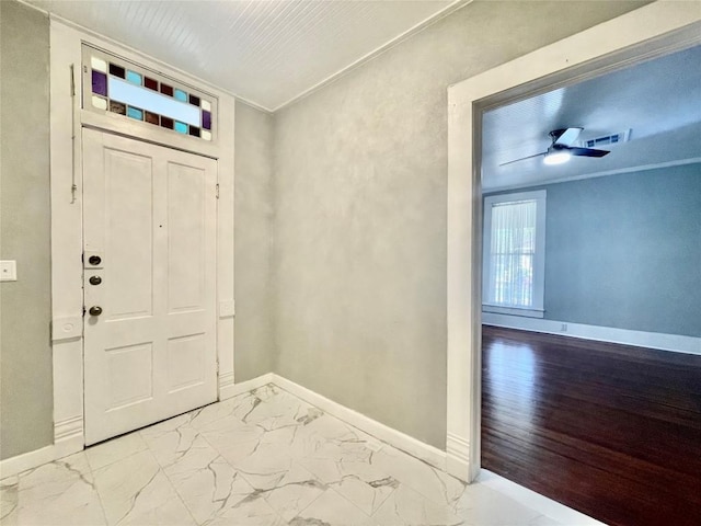 908 W Hopkins St, San Marcos, TX 78666 - entryway with baseboards, marble finish floors, and a ceiling fan