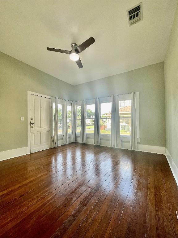 908 W Hopkins St, San Marcos, TX 78666 - empty room with a ceiling fan, hardwood / wood-style flooring, and baseboards