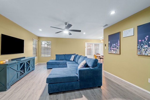 living area featuring baseboards, visible vents, a ceiling fan, light wood-style floors, and recessed lighting