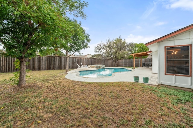 view of swimming pool with a patio area, a fenced backyard, a fenced in pool, and a yard