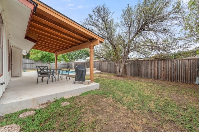 view of yard featuring a fenced in pool, a patio area, and a fenced backyard