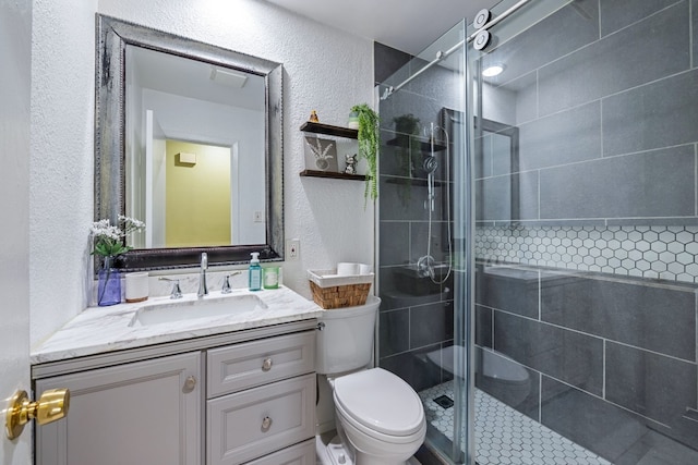 10212 W Rutland Vlg, Austin, TX 78758 - bathroom with a textured wall, toilet, vanity, and a shower stall