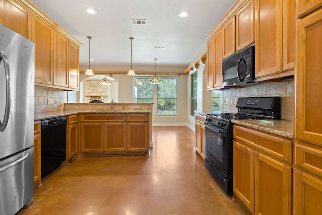 kitchen featuring visible vents, a sink, concrete flooring, a peninsula, and black appliances