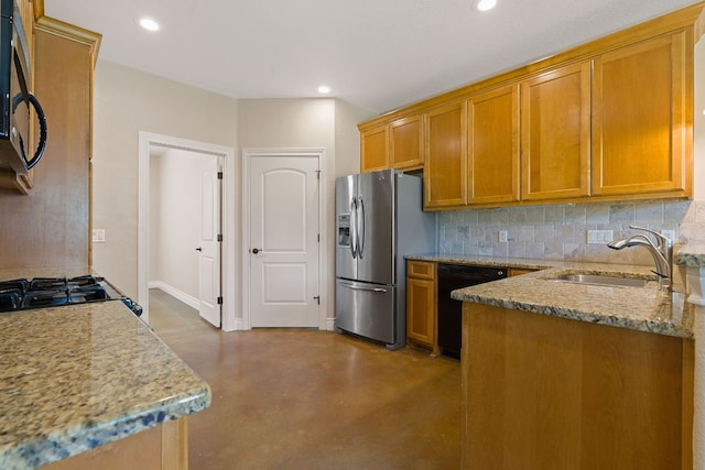 kitchen with a sink, black dishwasher, backsplash, stainless steel fridge with ice dispenser, and brown cabinetry