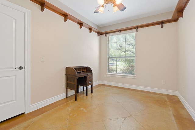 spare room with ceiling fan, beamed ceiling, and baseboards