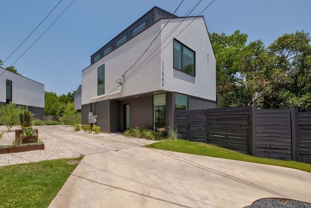 1706 Goodrich Ave Unit A, Austin, TX 78704 - view of front of property with driveway and stucco siding