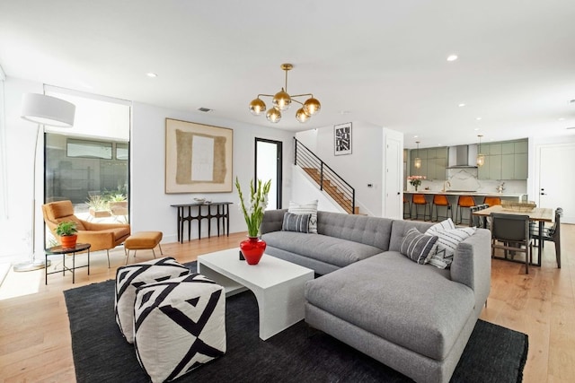 1706 Goodrich Ave Unit A, Austin, TX 78704 - living area featuring recessed lighting, a chandelier, light wood-type flooring, and stairway