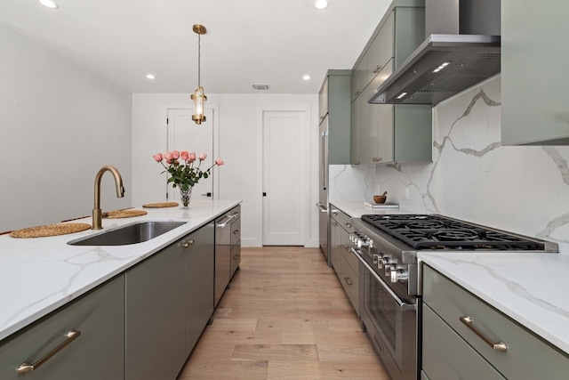 1706 Goodrich Ave Unit A, Austin, TX 78704 - kitchen featuring wall chimney range hood, high end stainless steel range oven, gray cabinets, and recessed lighting