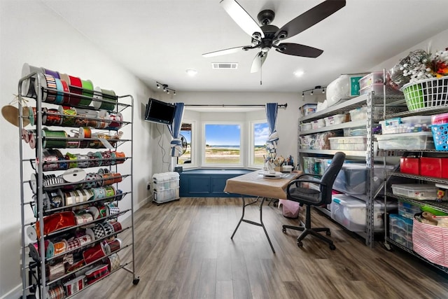 office with a ceiling fan, baseboards, visible vents, and wood finished floors