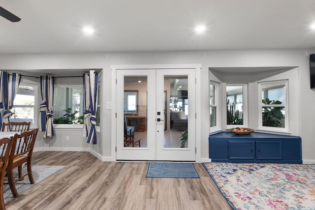 doorway to outside with recessed lighting, french doors, baseboards, and light wood finished floors