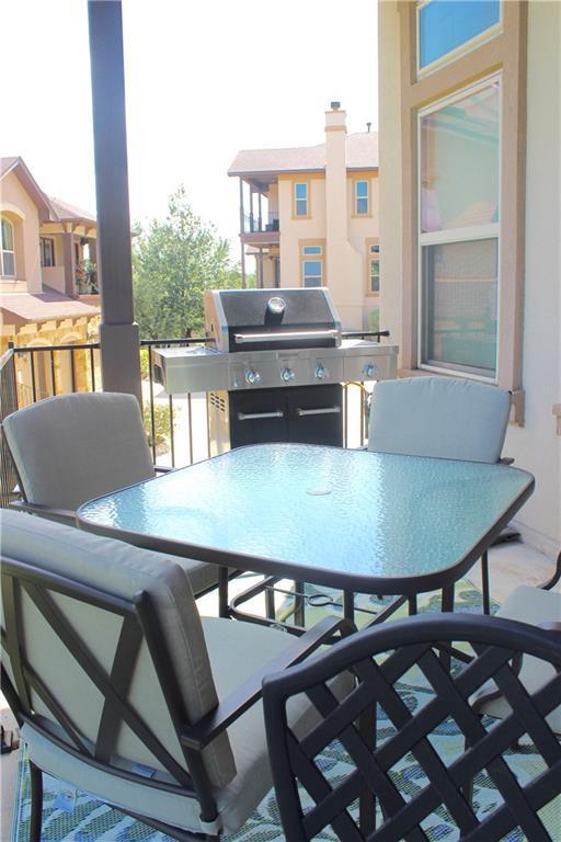 view of patio / terrace with outdoor dining space and a balcony