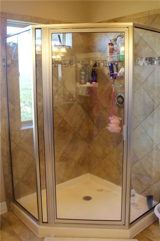 bathroom with a shower stall