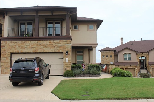 view of front of property featuring an attached garage, a balcony, concrete driveway, stucco siding, and a front lawn