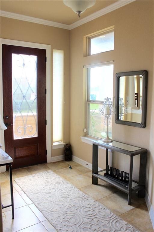 entrance foyer featuring crown molding, baseboards, and light tile patterned floors