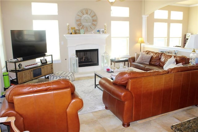 living area featuring a glass covered fireplace