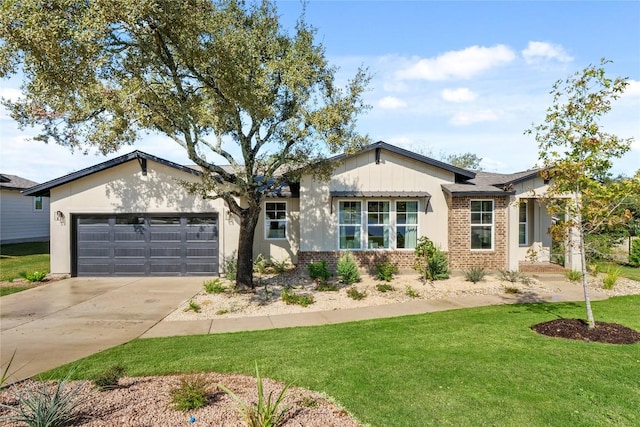 ranch-style home with a garage, a front yard, brick siding, and driveway