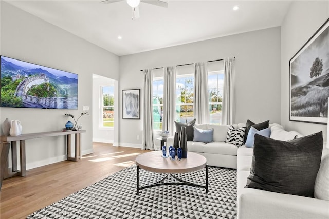 living room with recessed lighting, ceiling fan, baseboards, and wood finished floors