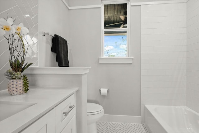 full bath featuring vanity, toilet, and baseboards