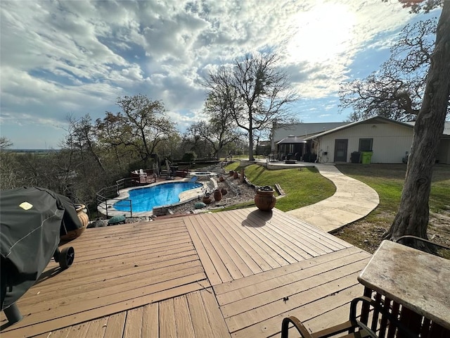 wooden terrace featuring a grill, an outdoor pool, a lawn, and a patio