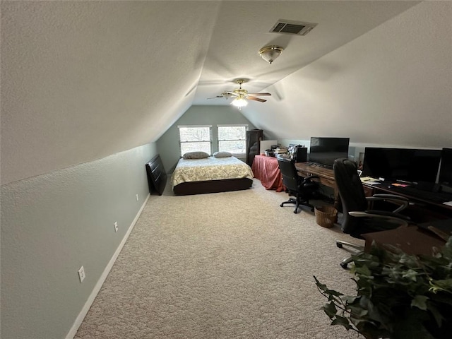 carpeted bedroom with a textured ceiling, a ceiling fan, visible vents, vaulted ceiling, and baseboards