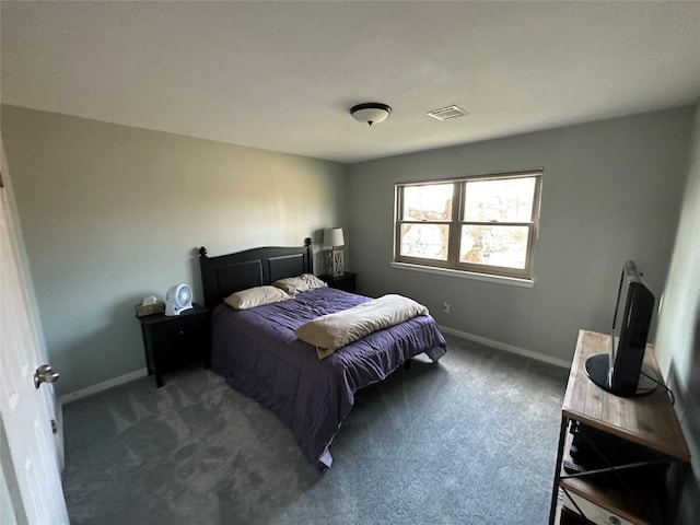 carpeted bedroom with visible vents and baseboards