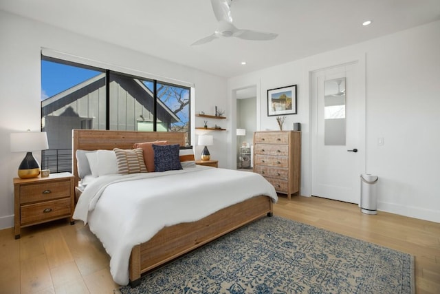 bedroom featuring light wood-type flooring, ceiling fan, baseboards, and recessed lighting