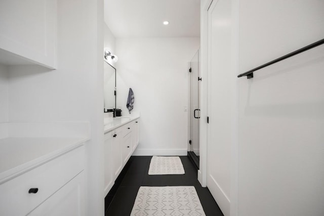 full bath with recessed lighting, vanity, baseboards, and tile patterned floors