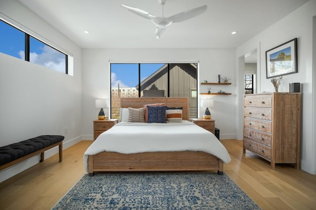 bedroom with light wood-style floors, baseboards, a ceiling fan, and recessed lighting