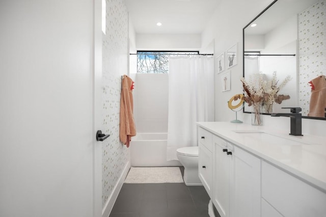 full bathroom featuring tile patterned flooring, vanity, toilet, and shower / bath combo with shower curtain