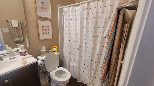 712 W 21st St Unit 202, Austin, TX 78705 - bathroom featuring vanity, toilet, a shower with curtain, and a textured wall