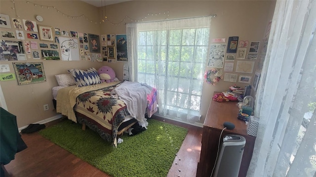 bedroom with wood finished floors