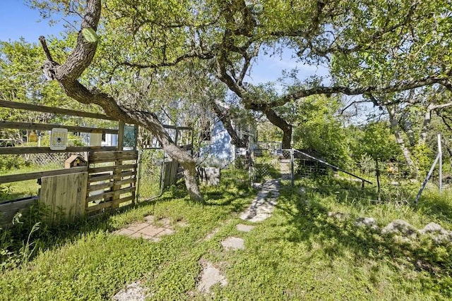 view of yard featuring a gate and fence