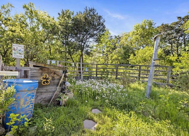 view of home's community with fence