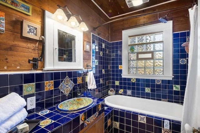 bathroom with tile walls and backsplash