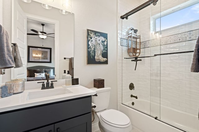1000 Flint Ridge Trl, Georgetown, TX 78628 - bathroom featuring vanity, toilet, bath / shower combo with glass door, and a ceiling fan