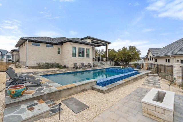 1000 Flint Ridge Trl, Georgetown, TX 78628 - view of pool with an in-ground hot tub, a patio area, and a fenced backyard