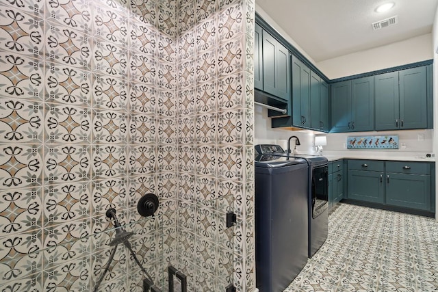 1000 Flint Ridge Trl, Georgetown, TX 78628 - laundry room with cabinet space and washer and clothes dryer