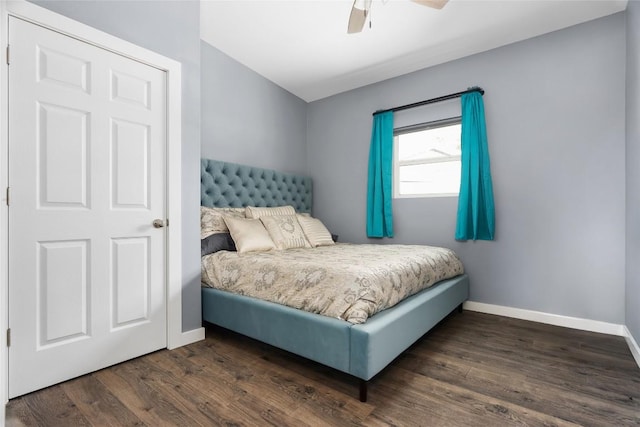 bedroom featuring dark wood-style floors, ceiling fan, and baseboards