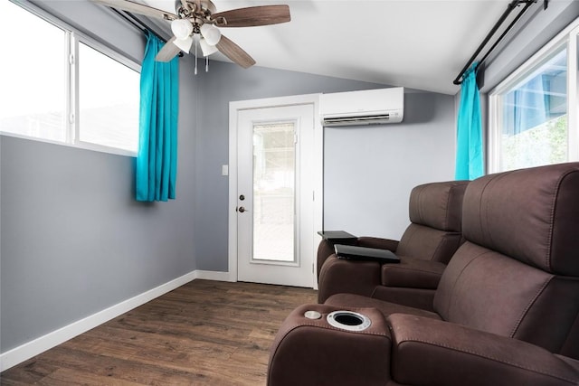 living area with dark wood-style floors, an AC wall unit, vaulted ceiling, ceiling fan, and baseboards