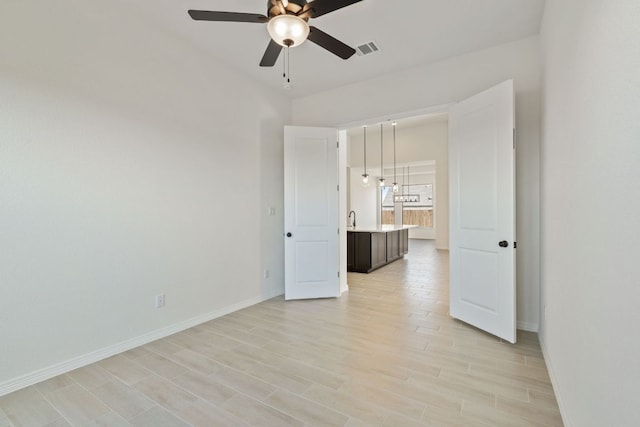 1832 Camay St, Leander, TX 78641 - spare room featuring ceiling fan and light wood-style flooring