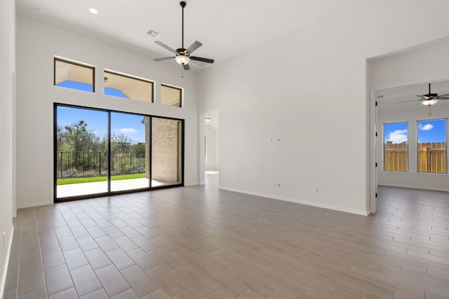 1832 Camay St, Leander, TX 78641 - empty room with a ceiling fan, a high ceiling, and wood finished floors