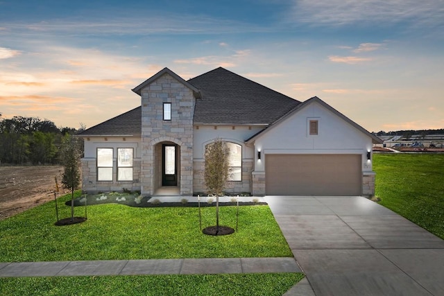 1832 Camay St, Leander, TX 78641 - french provincial home with stone siding, an attached garage, a front lawn, stucco siding, and driveway