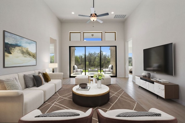 1832 Camay St, Leander, TX 78641 - living room with a towering ceiling, a ceiling fan, wood finished floors, and recessed lighting
