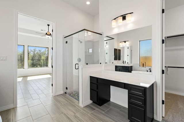 1832 Camay St, Leander, TX 78641 - bathroom featuring a shower stall, vanity, a ceiling fan, recessed lighting, and a spacious closet